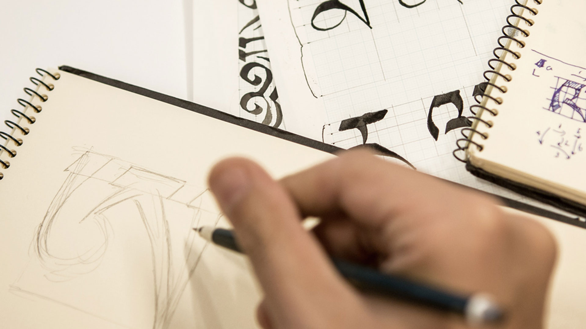 Foregin language fonts, image person drawing letters.